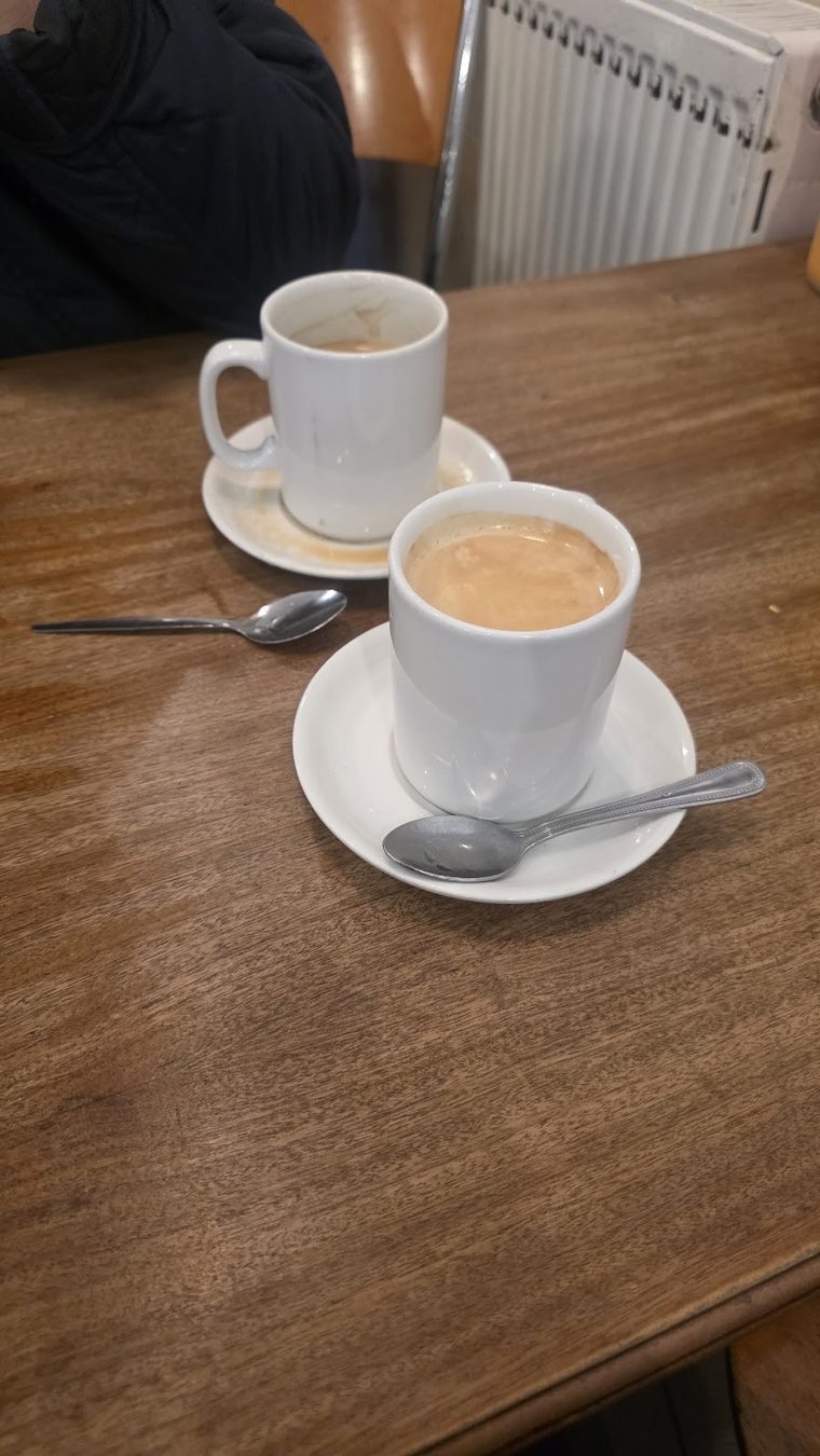 A cup of tea in a white cup and saucer